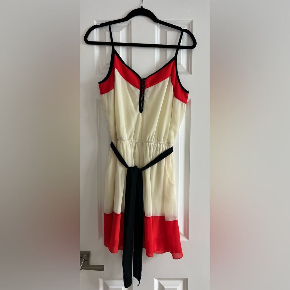 Stylish Cream Dress with Red and Black Accents